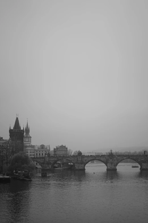 a black and white photo of a bridge over a river, by Gusztáv Kelety, 2 5 6 x 2 5 6, beautiful city, misty castle, random