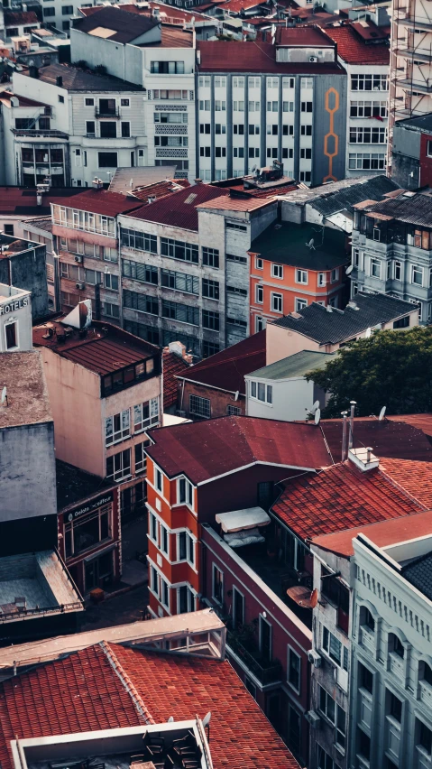 a view of a city from the top of a building, a colorized photo, pexels contest winner, red roofs, solid background, turkey, detailed street