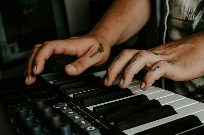 a close up of a person playing a keyboard, by Matt Cavotta, trending on pexels, aussie baristas, single pair of hands, ( ultra realistic, focus on the musicians