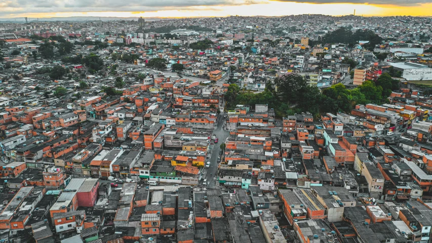 a large city filled with lots of tall buildings, an album cover, pexels contest winner, quito school, tiled roofs, aerial, neighborhood, brown