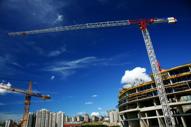 a crane that is sitting on top of a building, lots of building, posing