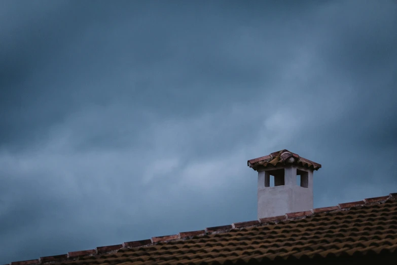 a chimney on top of a roof under a cloudy sky, inspired by Elsa Bleda, unsplash contest winner, thunderstorm in marrakech, 8k 50mm iso 10, today\'s featured photograph 4k, background image