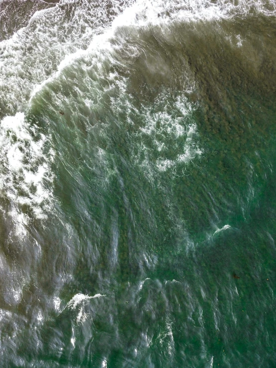 a man riding a surfboard on top of a wave, an album cover, inspired by Andreas Gursky, pexels contest winner, satellite view, green slime, closeup of magic water gate, south african coast