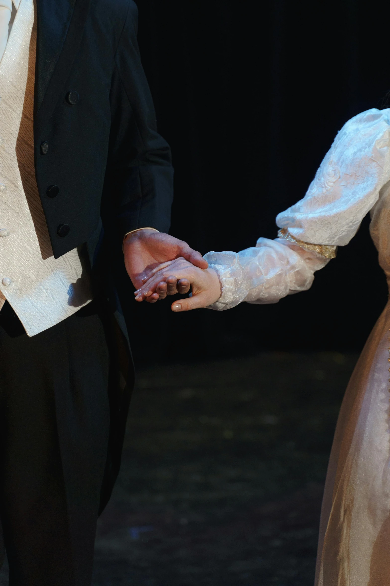 a man in a tuxedo and a woman in a dress, emerging hands, wearing victorian rags, ( ( theatrical ) ), details