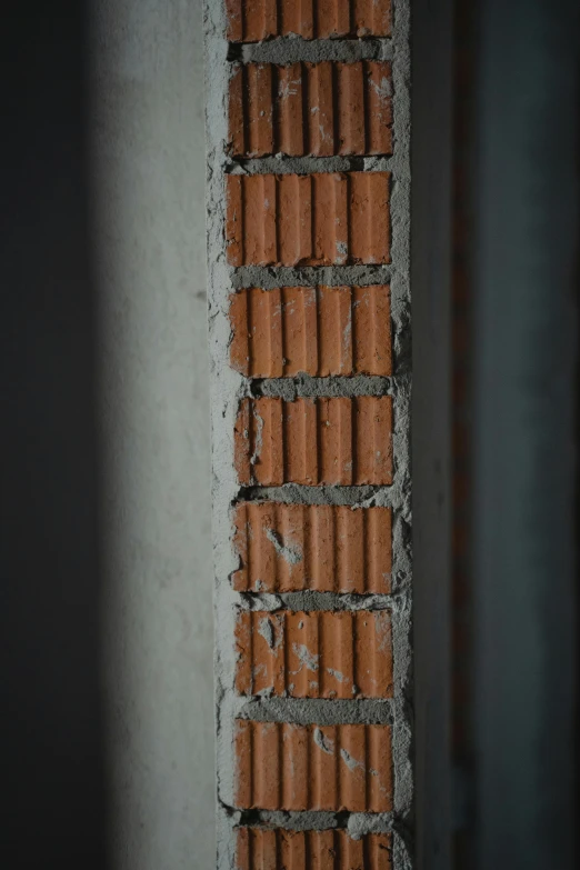 a red fire hydrant sitting next to a brick wall, by Eglon van der Neer, pexels contest winner, postminimalism, under construction, tall thin build, 4 k close up, gray concrete