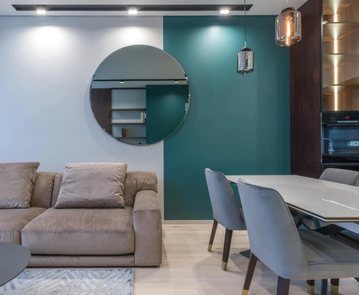 a living room filled with furniture and a round mirror, by Alexander Fedosav, pexels contest winner, teal electricity, flat grey color, recessed, ultra modern