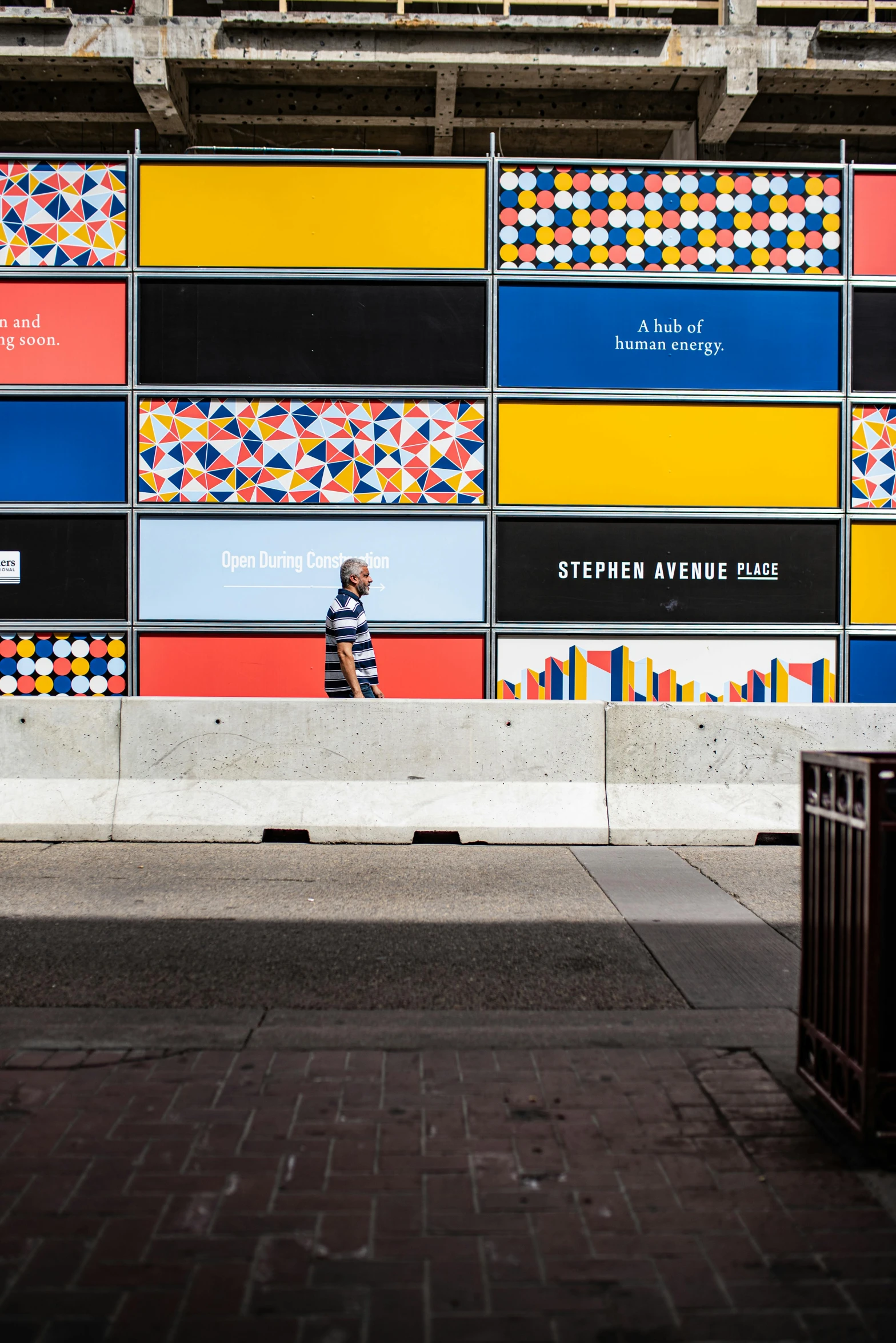 a man riding a skateboard on top of a sidewalk, inspired by Joel Shapiro, temporary art, colorful glass wall, billboard image, national portrait gallery, primary color scheme