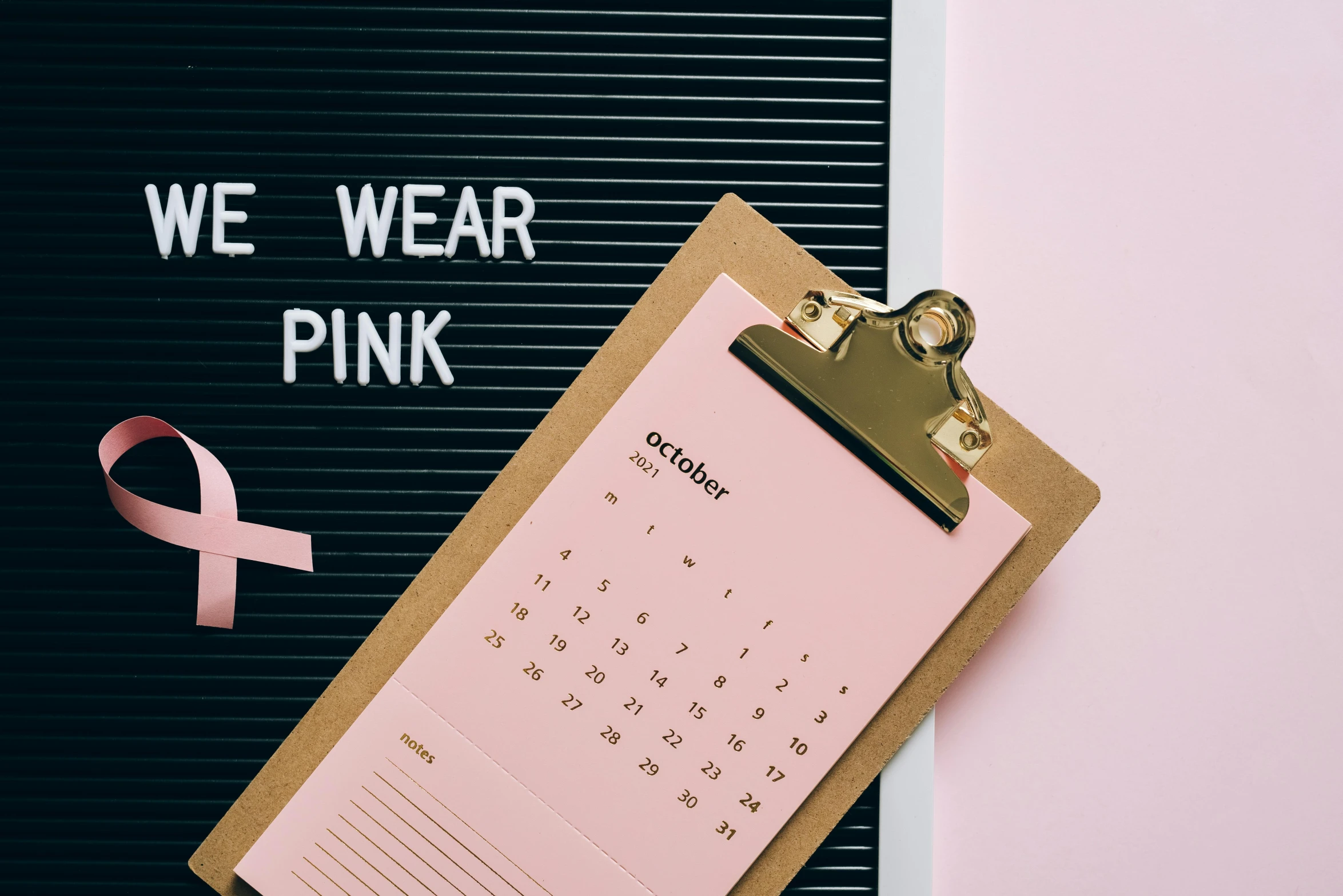 a clipboard with a pink ribbon attached to it, trending on pexels, happening, pink clothes, female calendar, eleven/millie bobbie brown, nursing