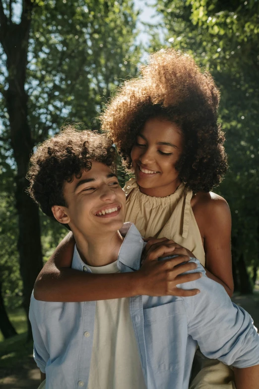 a man carrying a little girl in his arms, trending on pexels, renaissance, dark short curly hair smiling, teenage girl, lovers, and