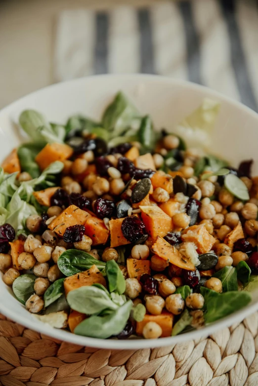 a close up of a bowl of food on a table, by Kristin Nelson, pexels, square, salad, bittersweet, polka dot