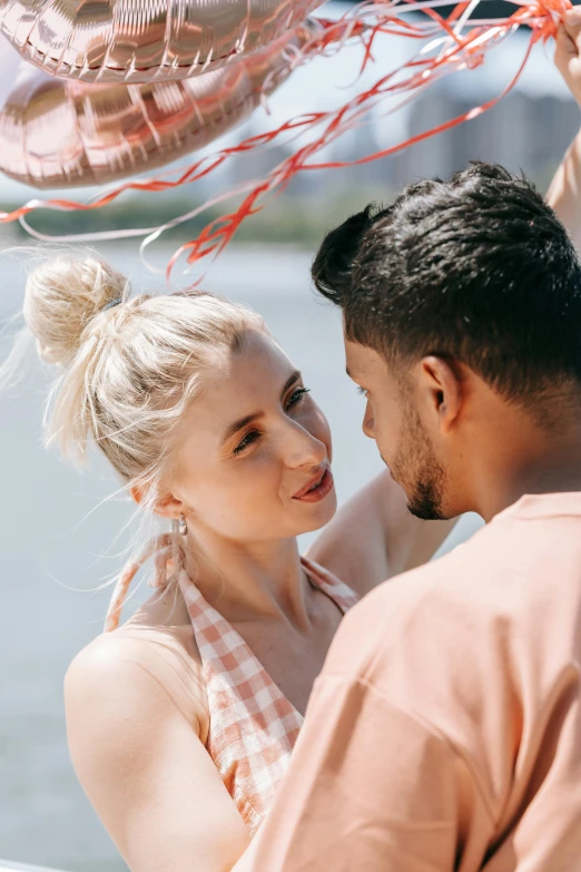 a man and woman standing next to each other on a boat, trending on pexels, renaissance, close up of a blonde woman, celebration, asian man, hearts