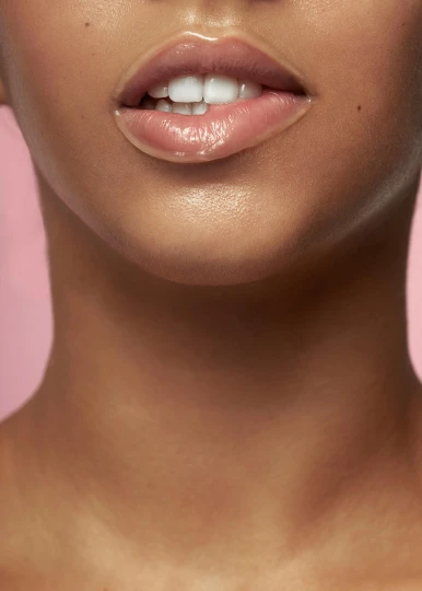 a close up of a woman's face on a pink background, an album cover, inspired by Martin Schoeller, trending on pexels, defined jawline, fully frontal view, natural complexion, tongue out