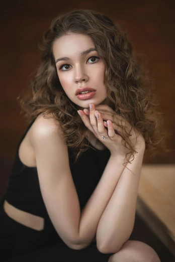 a beautiful young woman sitting on top of a wooden bench, by irakli nadar, trending on pexels, photorealism, brown curly hair, beautiful studio face, 🤤 girl portrait, japanese model