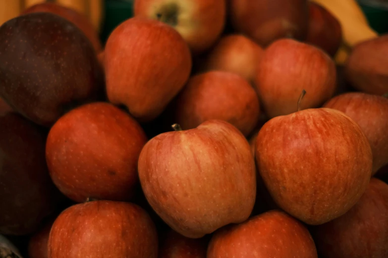 a pile of apples sitting on top of a table, reddish - brown, thumbnail, close up image