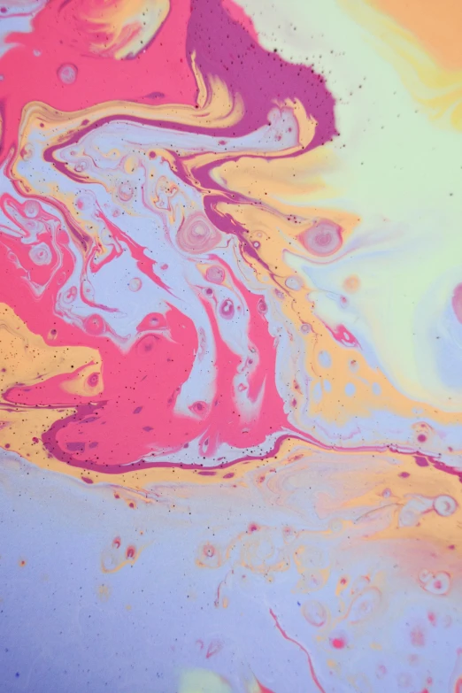 a close up of a painting on a table, inspired by Shōzō Shimamoto, trending on unsplash, abstract art, made of liquid, sherbert sky, marbled, abstraction chemicals