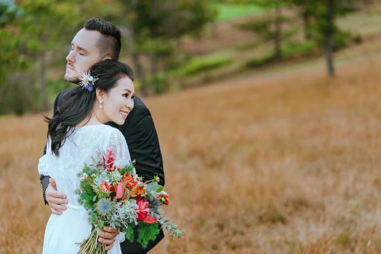 a man and woman standing next to each other in a field, unsplash, romanticism, ao dai, bouquet, avatar image, tourist photo