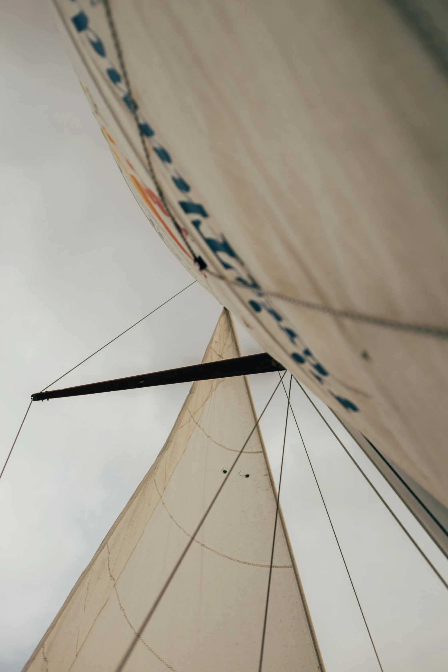 a close up of a sail on a cloudy day, inspired by Willem van de Velde the Elder, unsplash, overhead canopy, low quality photo, tall, close - up profile