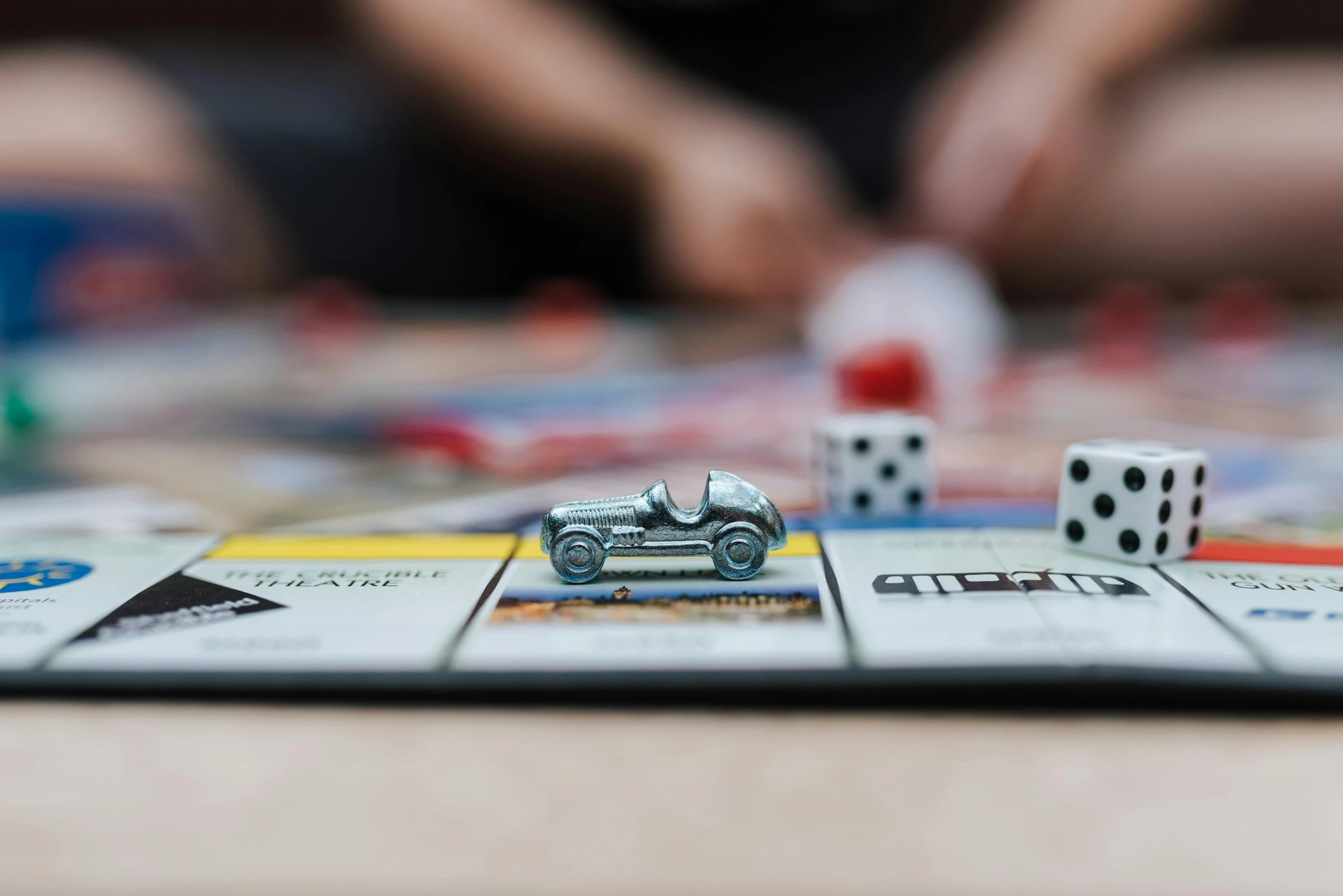 a couple of dice pieces sitting on top of a table, a picture, by Carey Morris, unsplash, miniature of a sports car, families playing, square, 15081959 21121991 01012000 4k