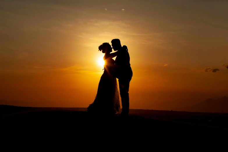 a silhouette of a bride and groom at sunset, by Peter Churcher, pexels contest winner, golden hour 8 k, rectangle, plain, making love