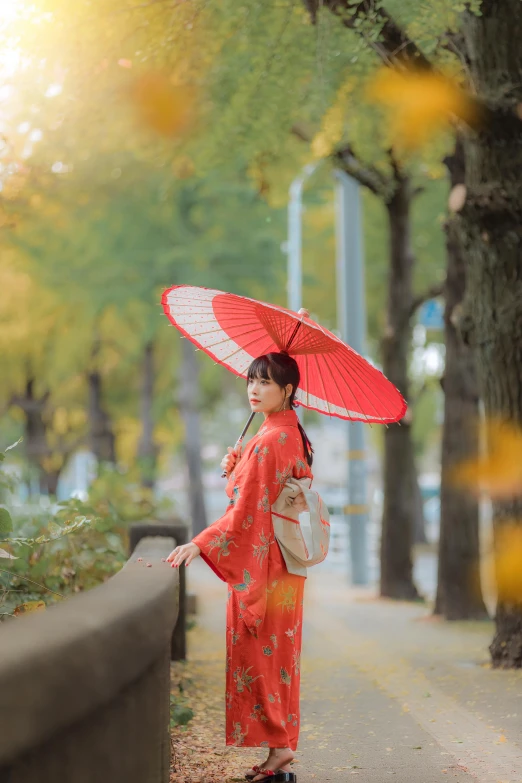 a woman in a red kimono holding an umbrella, 5 0 0 px models, 🚿🗝📝, of a youthful japanese girl, red and orange glow