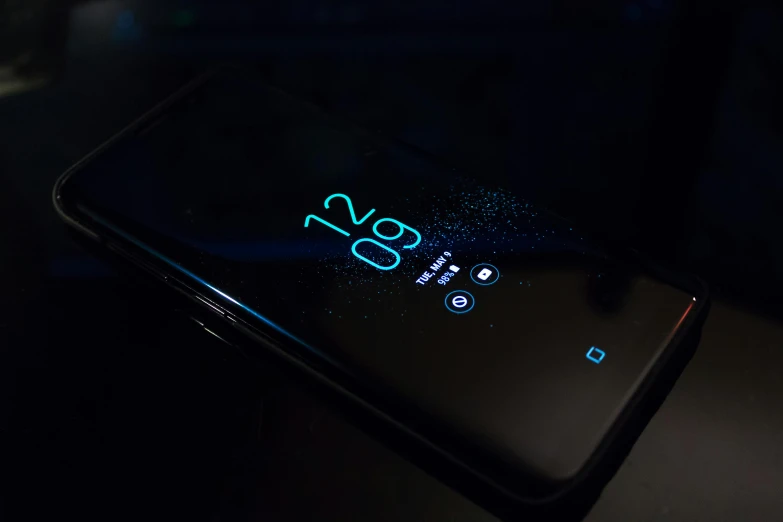 a close up of a cell phone on a table, a hologram, by Android Jones, pexels, dark theme night time, background image, hyperdetailed samsung store, ultrawide cinematic 3d render