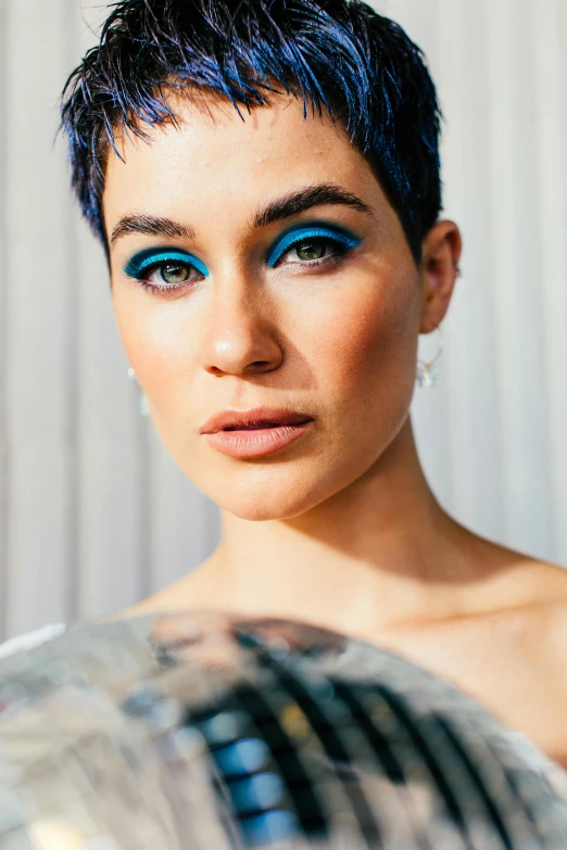 a close up of a person with a mirror ball, blue short hair, defined cheekbones, 2 5 yo, feature