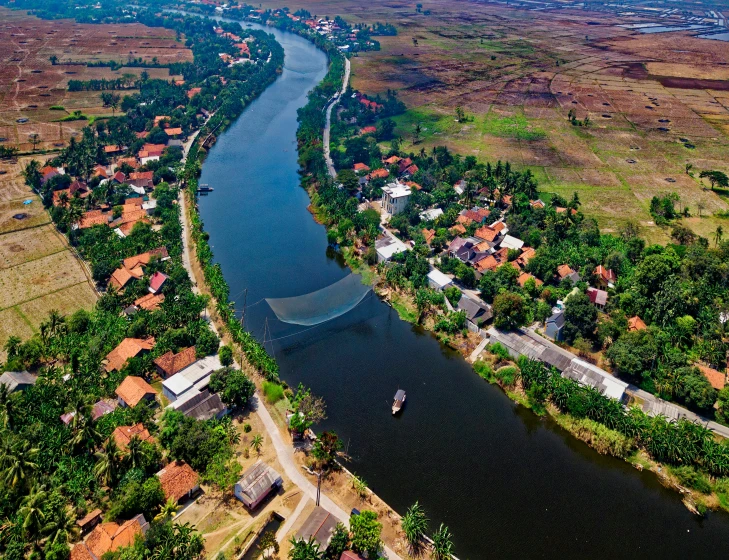 a river running through a lush green countryside, by Daniel Lieske, pexels contest winner, hurufiyya, flooded fishing village, airplane view, thawan duchanee, historical image