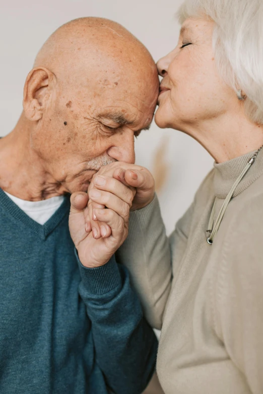 a man kissing a woman on the cheek, by Matija Jama, trending on unsplash, renaissance, dementia, holding each other hands, brown, 256435456k film