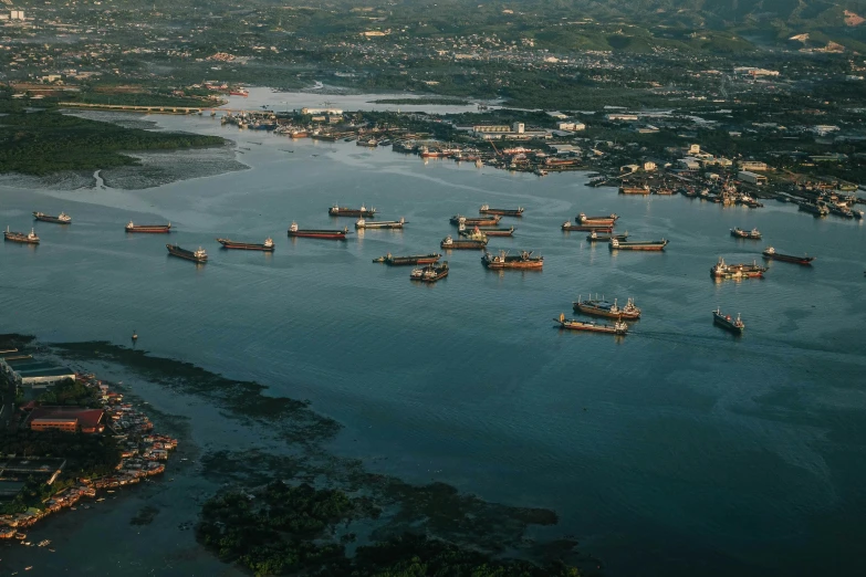 a large body of water filled with lots of boats, by Joseph Severn, pexels contest winner, hurufiyya, shipping docks, manila, subsurface scandering, 2023