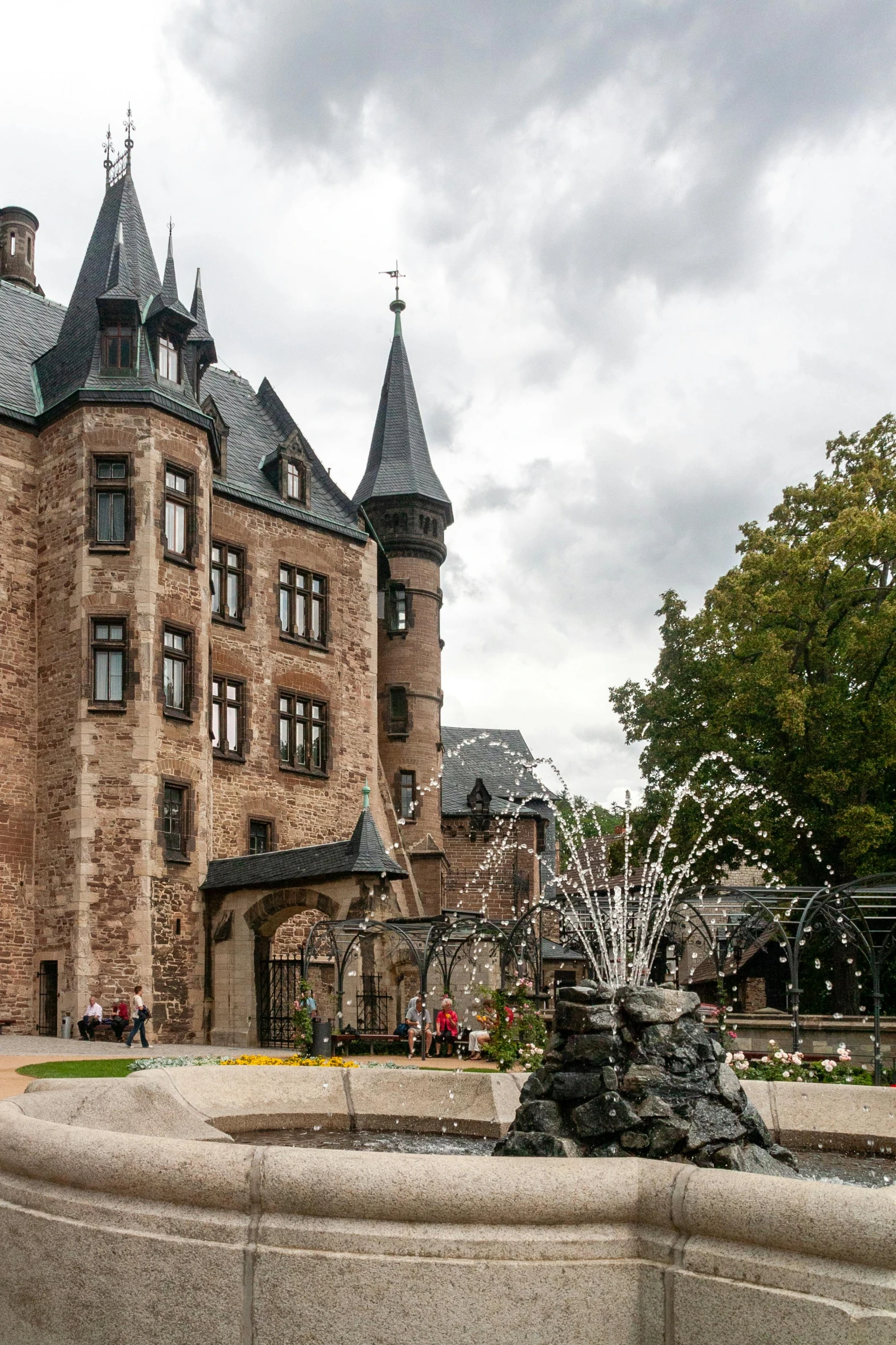 a large building with a fountain in front of it, inspired by Albert Paris Gütersloh, art nouveau, in a castle, slate, award - winning, outside view