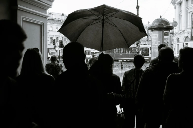 a black and white photo of a crowd of people, a black and white photo, pexels contest winner, hyperrealism, parasol, looking outside, biennale, moscow metro