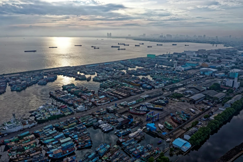 a large body of water filled with lots of boats, by Daniel Lieske, pexels contest winner, happening, shipping docks, jakarta, 2 0 2 2 photo, thumbnail