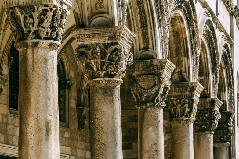 a row of columns in front of a building, a marble sculpture, unsplash contest winner, romanesque, interior of the old cathedral, overturned ornate chalice, dubrovnik, youtube thumbnail