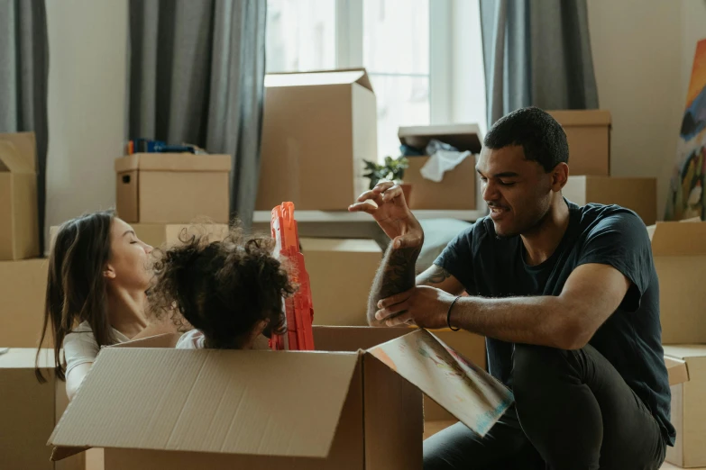 a man and a little girl sitting in a cardboard box, in a living room, inspect in inventory image, sydney, profile image