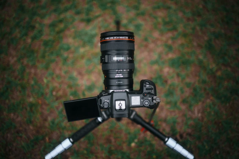 a camera sitting on top of a tripod, unsplash, photorealism, ground camera, sigma lens photo, looking directly at the camera, dof:-1