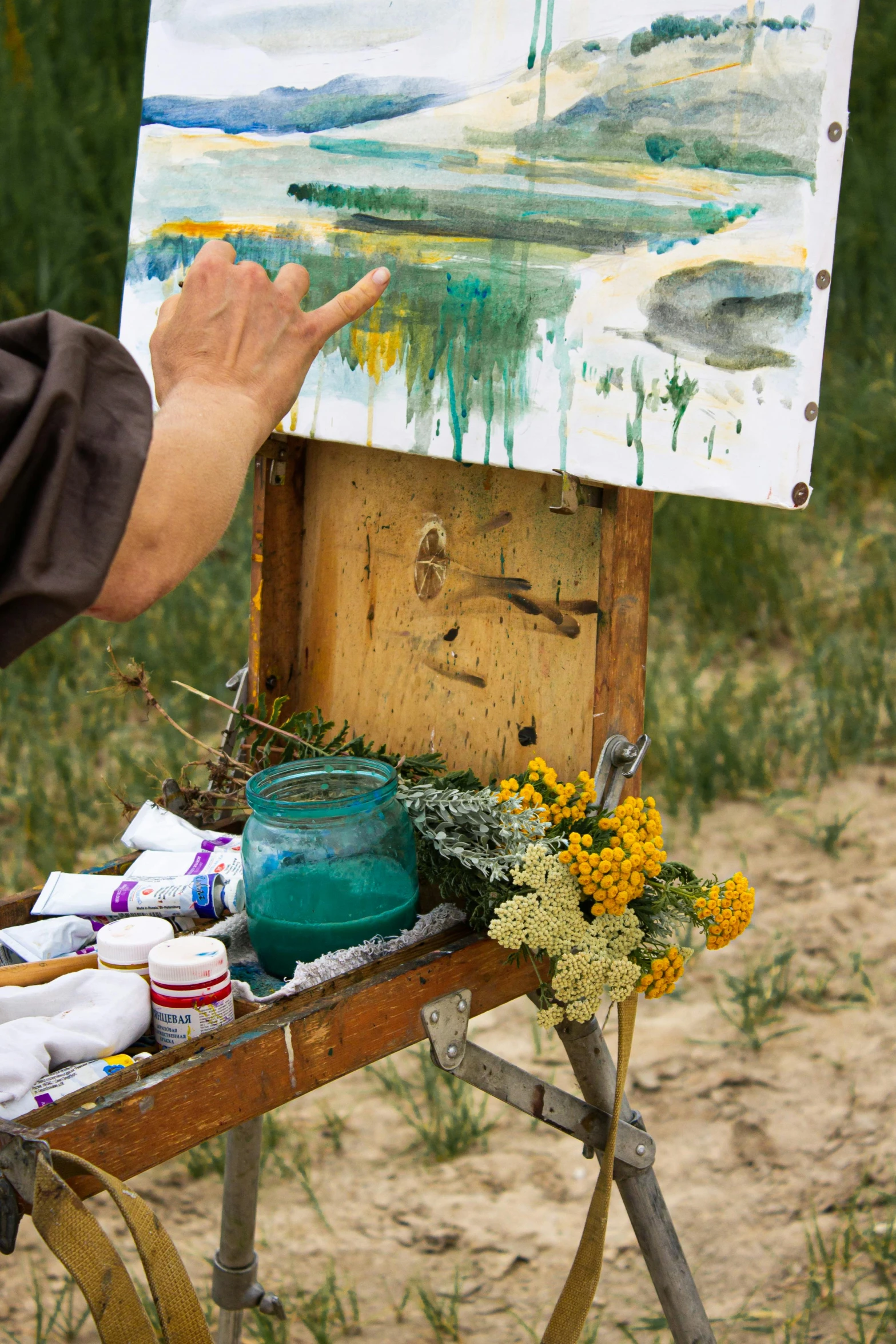 a man that is standing in front of a painting, an impressionist painting, inspired by Winslow Homer, process art, tending on art station, al fresco, prairie, wild brush strokes