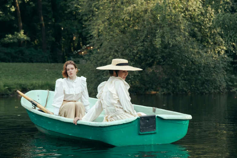 a couple of women sitting on top of a green boat, inspired by Édouard Manet, unsplash, renaissance, production still, pond, walking down, eleanor tomlinson