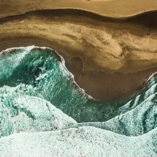 a large body of water next to a sandy beach, by Dan Christensen, pexels contest winner, hyperrealism, drone photograpghy, mutiversal tsunami, ignant, hollister ranch