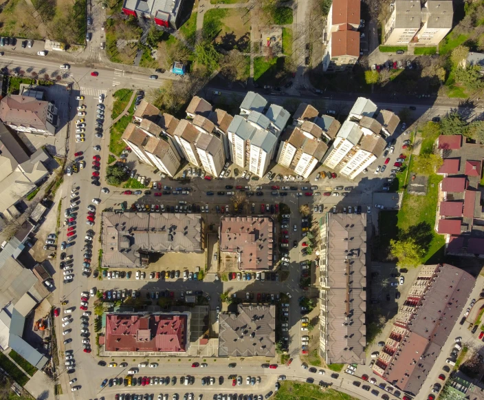 an aerial view of a city with lots of buildings, a portrait, by Adam Marczyński, shutterstock, high polygon, soviet apartment buildings, pentagon, low - angle shot