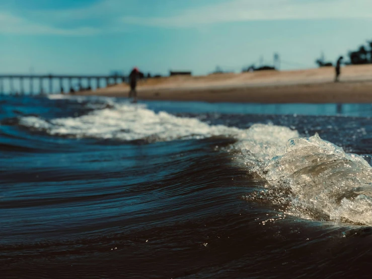 a person riding a surfboard on top of a wave, pexels contest winner, near a jetty, victorian arcs of sand, thumbnail, water line surface