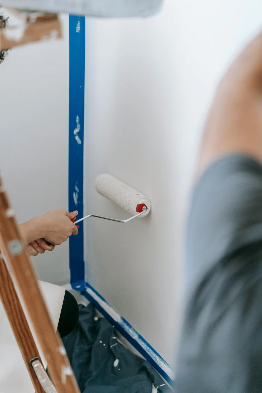 a man painting a wall with a paint roller, a detailed painting, by Julia Pishtar, pexels contest winner, basic white background, people at work, blue paint on top, rectangle