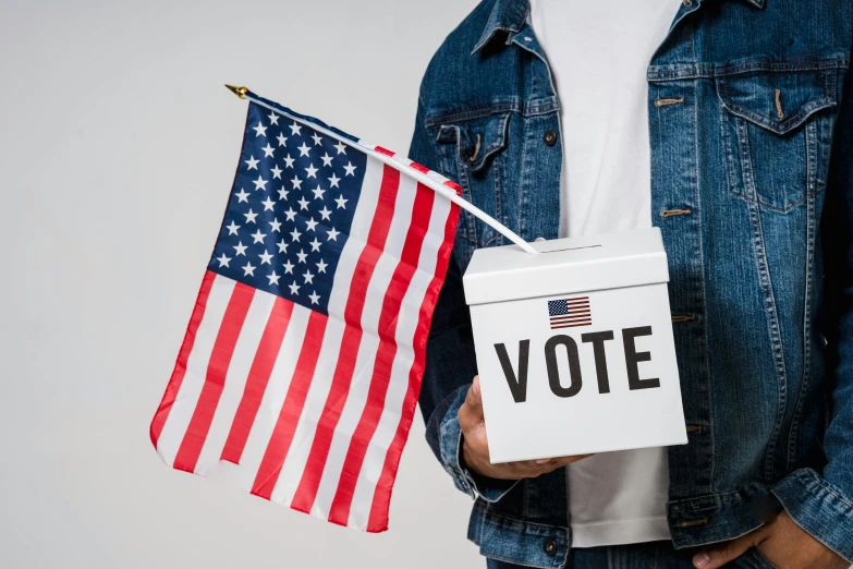a man holding an american flag and a voting box, a portrait, trending on pexels, renaissance, instagram post, background image, cutout, vine