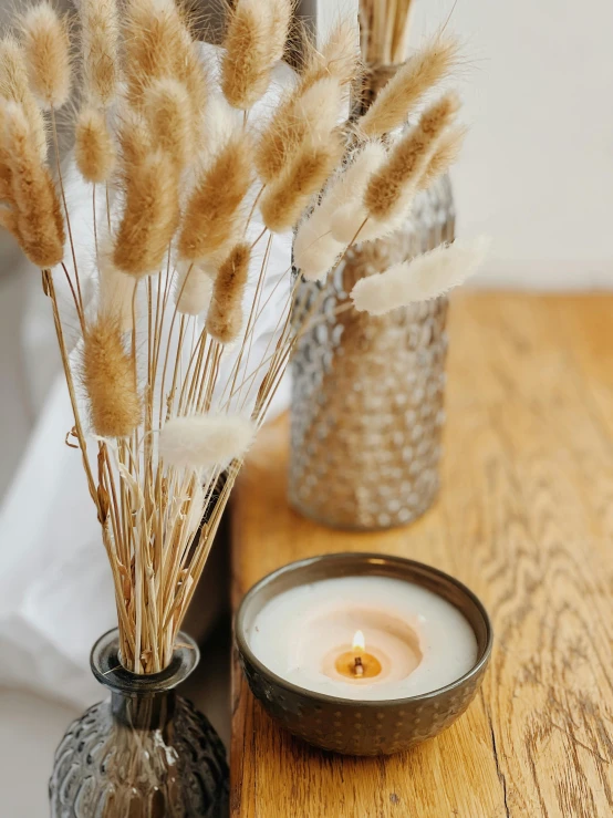 a couple of vases sitting on top of a wooden table, bullrushes, candle lit, soft and fluffy, product image