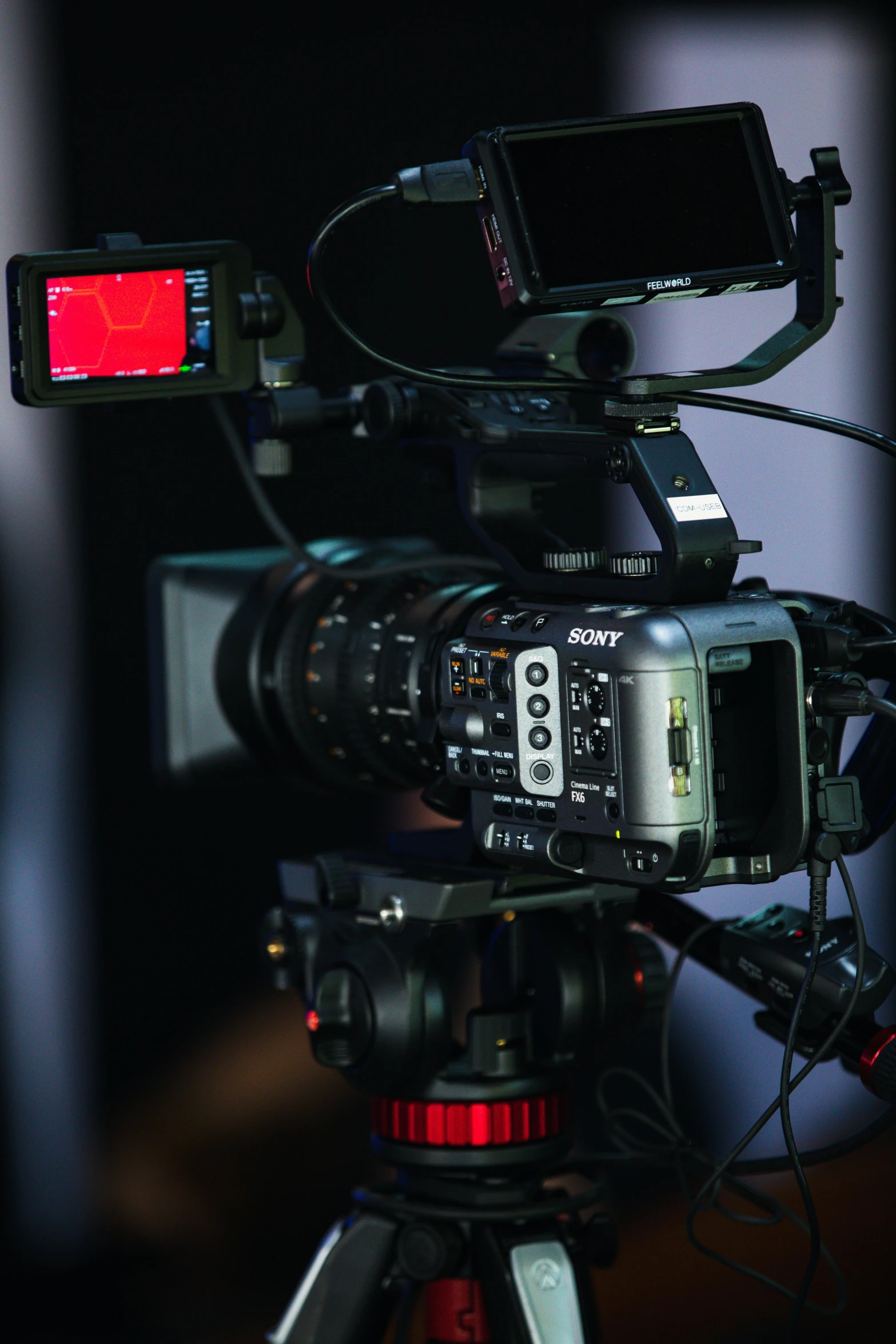 a close up of a camera on a tripod, by Jason Felix, pexels, video art, sony fx 6, tv studio, with back to the camera, 6 0 mm lens in full armor