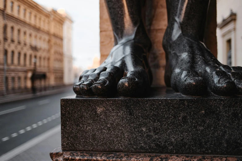 a close up of a statue of a person's feet, inspired by Sir Jacob Epstein, pexels contest winner, hyperrealism, street of moscow, monumental giant palace, looking towards camera, obsidian hooves