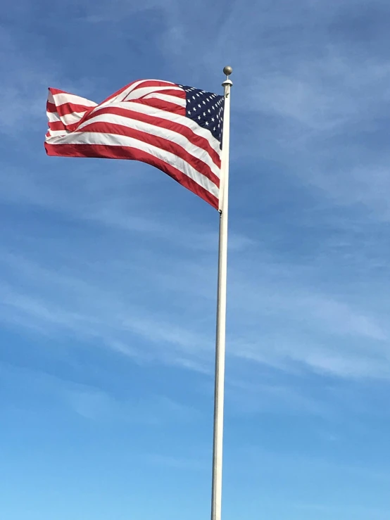 an american flag flying in the wind on a sunny day, by Carey Morris, instagram story, square, taken on iphone 14 pro, high resolution