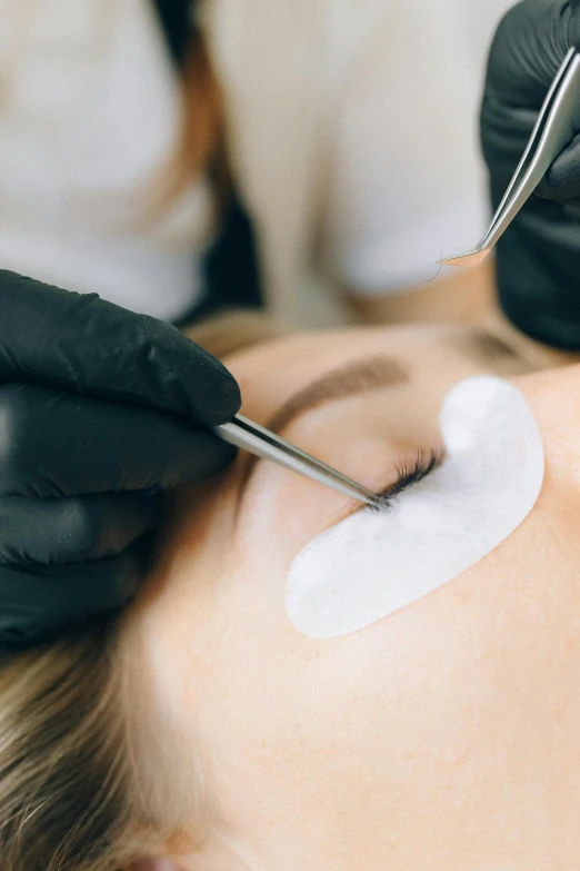 a woman getting her eyebrows done at a beauty salon, trending on pexels, square black pupil centered, banner, 2717433015, thumbnail