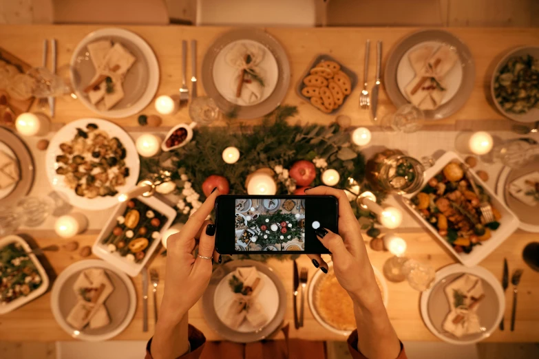 a person taking a picture of a table full of food, a picture, christmas night, avatar image, flatlay, profile image