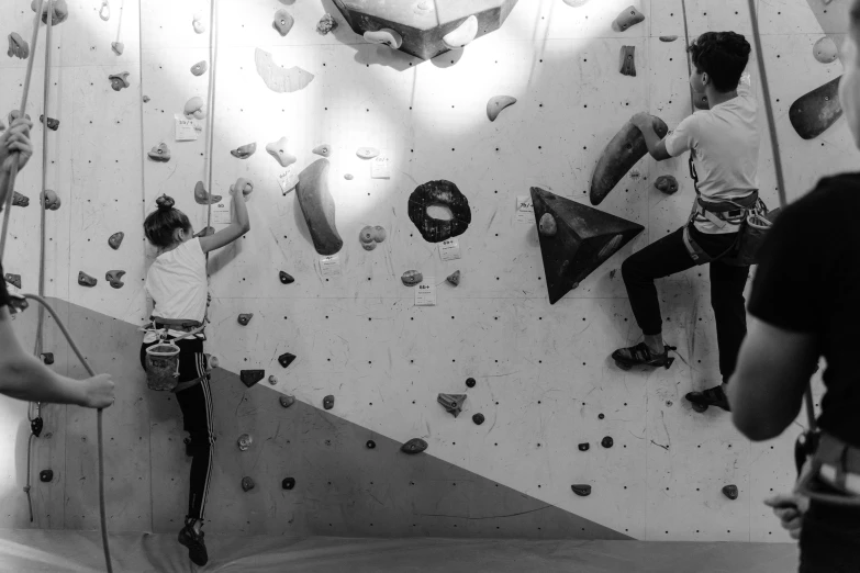 a black and white photo of people climbing on a wall, indoor, 15081959 21121991 01012000 4k, m, featured