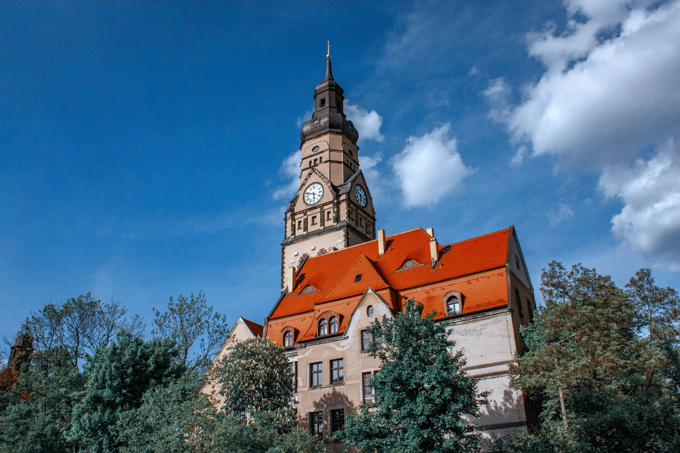 a large building with a clock tower on top of it, by Thomas Häfner, pexels contest winner, czeslaw znamierowski, color image, square, high quality upload